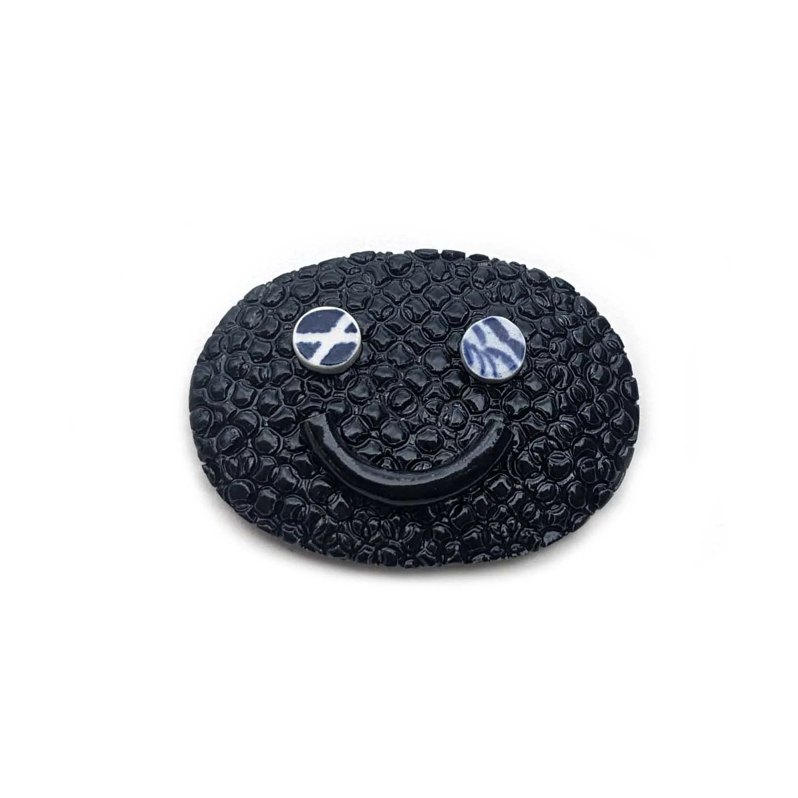 Broche Face